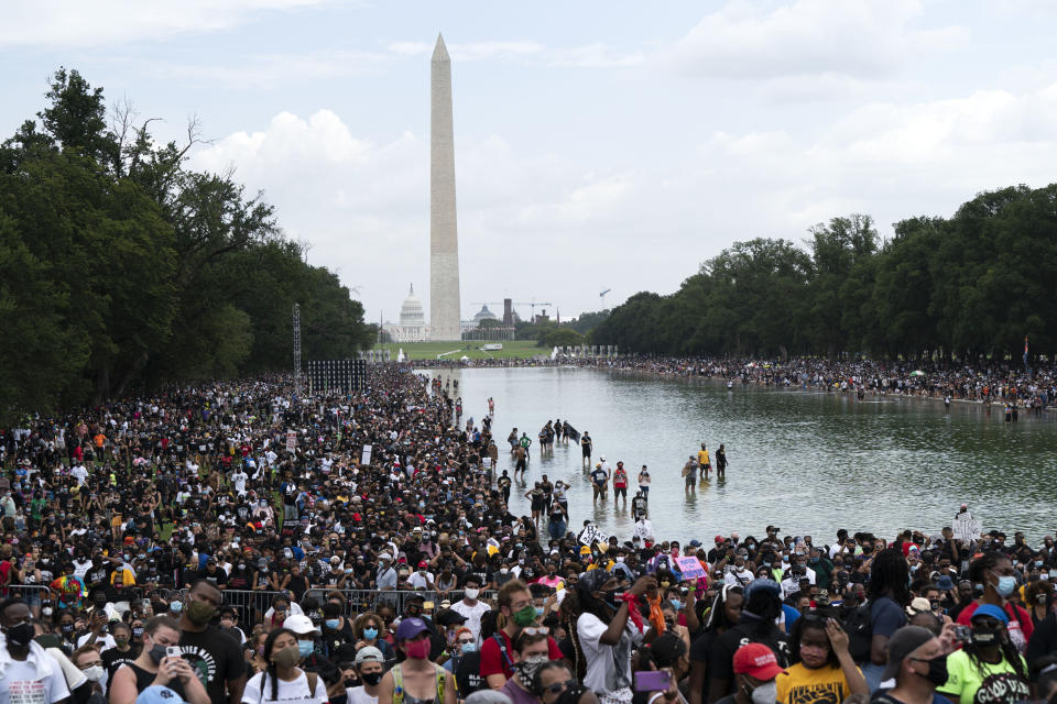 People rally at Lincoln Memorial during the March on Washington, Friday Aug. 28, 2020, on the 57th anniversary of the Rev. Martin Luther King Jr.'s "I Have A Dream" speech. (AP Photo/Jose Luis Magana)