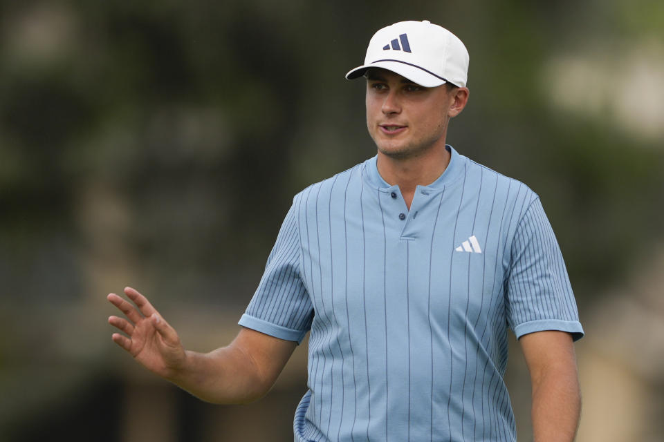 Ludvig Aberg, of Sweden, waves on the 17th hole during the third round of the RBC Heritage golf tournament, Saturday, April 20, 2024, in Hilton Head Island, S.C. (AP Photo/Chris Carlson)