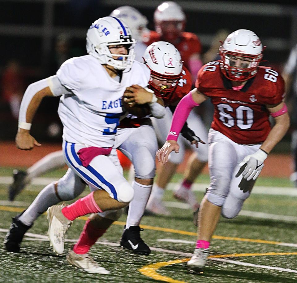 South Hunterdon's Anthony Venetonne runs as Dunellen's Luke Shealy goes for the tackle in a game on Oct. 6, 2023.