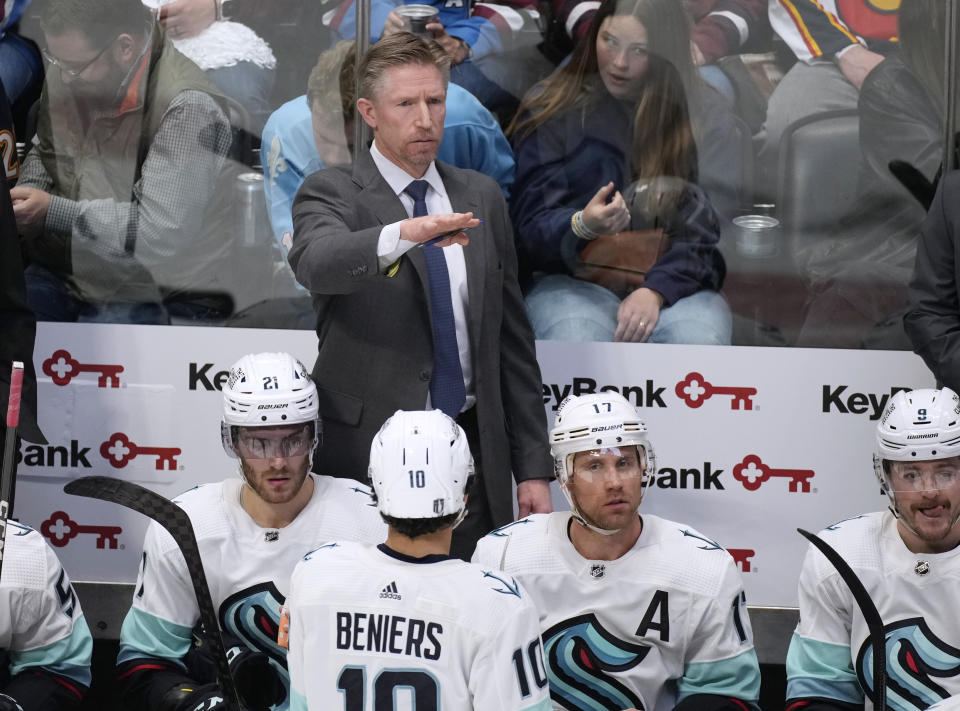 Seattle Kraken coach Dave Hakstol directs players against the Colorado Avalanche during the third period of Game 5 of an NHL hockey first-round playoff series Wednesday, April 26, 2023, in Denver. (AP Photo/David Zalubowski)