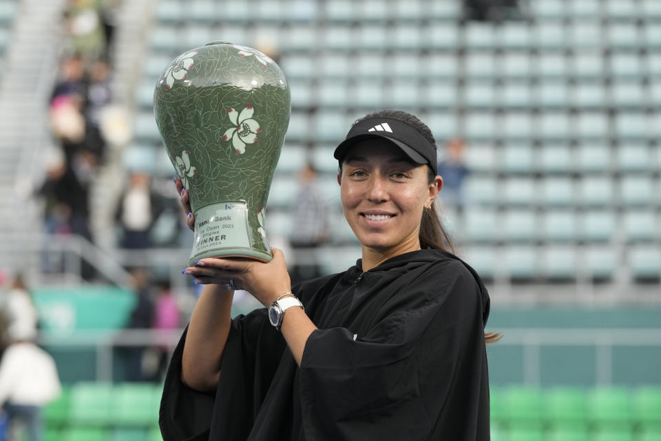 Jessica Pegula of the United States holds up her winning trophy after defeating Yue Yuan of China in their final match of the Korea Open tennis championships in Seoul, South Korea, Sunday, Oct. 15, 2023. (AP Photo/Ahn Young-joon)
