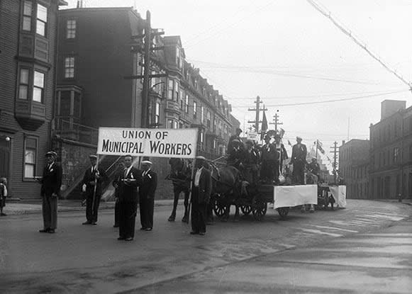 Unionized municipal workers in St. John's fly their banner in the city's 1930 Labour Day parade. Courtesy of The Rooms. (Public domain/The Rooms - image credit)