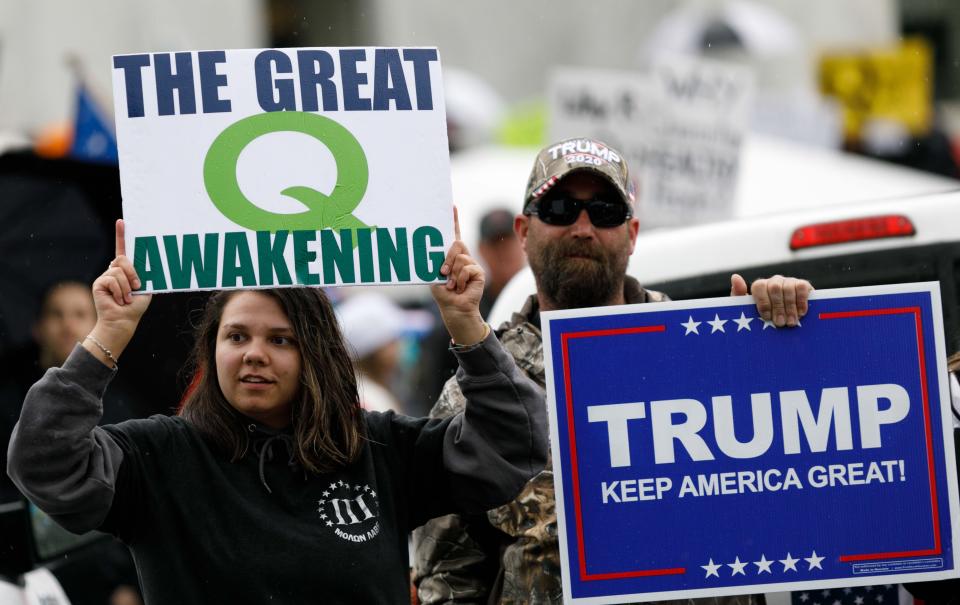 QAnon conspiracy theorists hold signs during a protest at the state Capitol in Salem, Oregon, May 2, 2020. (Photo: John Rudoff/Anadolu Agency via Getty Images)