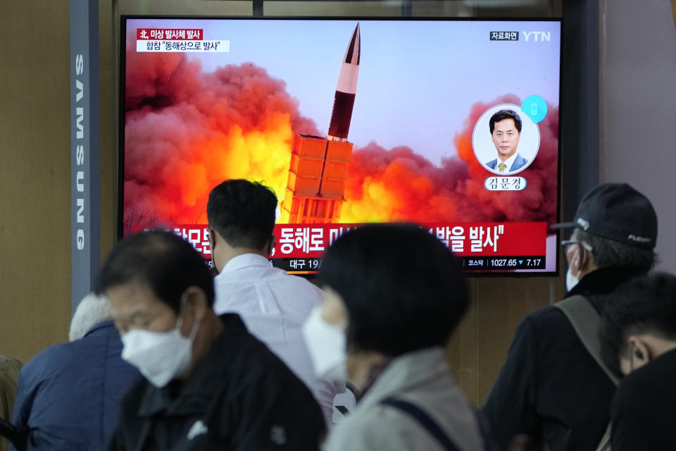 People watch a TV showing a file image of North Korea's missile launch during a news program at the Seoul Railway Station in Seoul, South Korea, Tuesday, Sept. 28, 2021. North Korea on Tuesday fired a suspected ballistic missile into the sea, Seoul and Tokyo officials said, the latest in a series of weapons tests by Pyongyang that raised questions about the sincerity of its recent offer for talks with South Korea. (AP Photo/Ahn Young-joon)