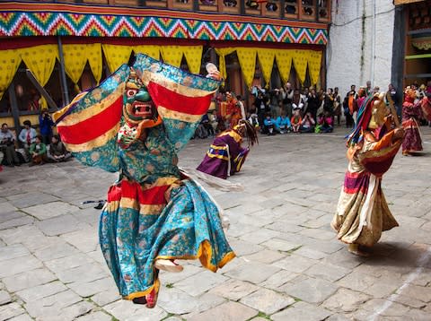 April: Peter Griffiths captures the vibrant atmotsphere during a traditional Cham dance in Bhutan - Credit: Peter Griffiths