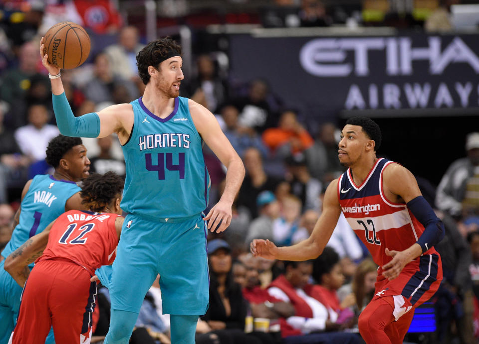 Frank Kaminsky definitely had his hands full on Thursday. (AP Photo)