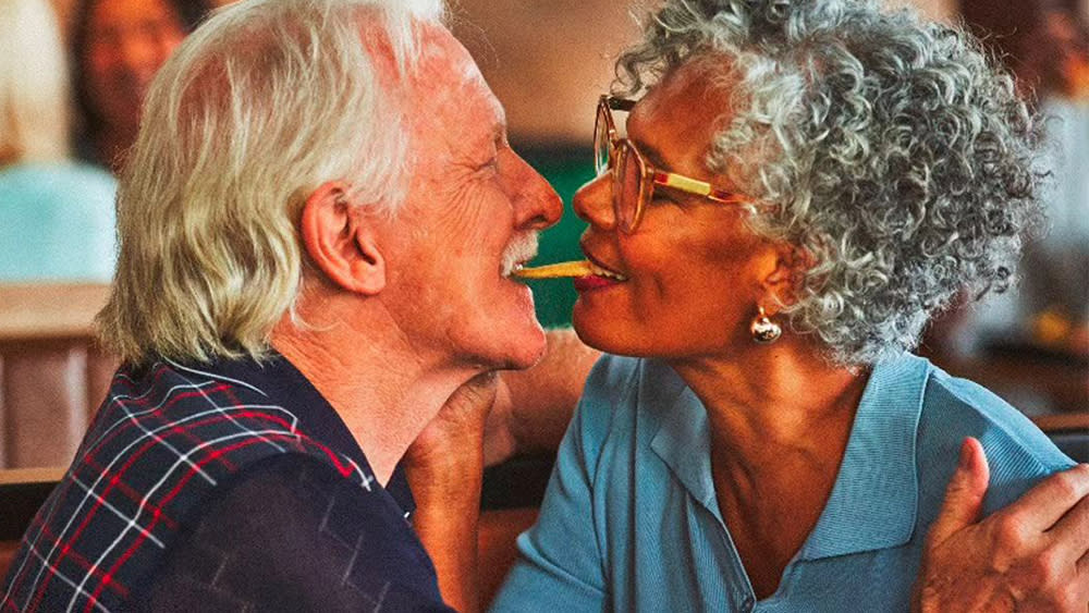  Image of an elderly couple kissing from a Burger King ad campaign. 