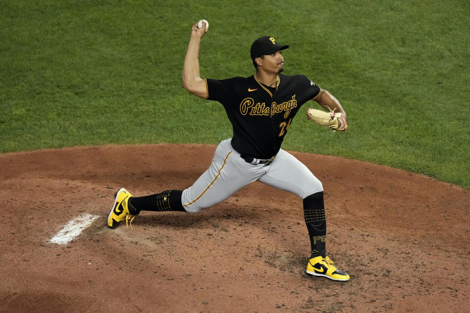 Pittsburgh Pirates starting pitcher Johan Oviedo throws during the fifth inning of a baseball game against the Kansas City Royals Monday, Aug. 28, 2023, in Kansas City, Mo. (AP Photo/Charlie Riedel)