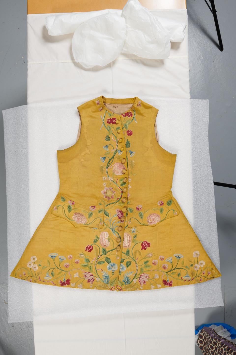 A men’s waistcoat, circa 1740-1750, in yellow silk with floral embroidery, from the permanent collection of the Palais Galliera museum in Paris. - Credit: Courtesy of Palais Galliera