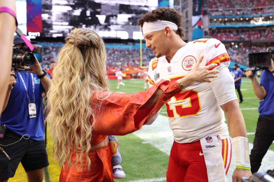 GLENDALE, ARIZONA - FEBRUARY 12: Brittany Mahomes and Patrick Mahomes #15 of the Kansas City Chiefs embrace on the field prior to Super Bowl LVII between the Kansas City Chiefs and Philadelphia Eagles at State Farm Stadium on February 12, 2023 in Glendale, Arizona. (Photo by Christian Petersen/Getty Images)
