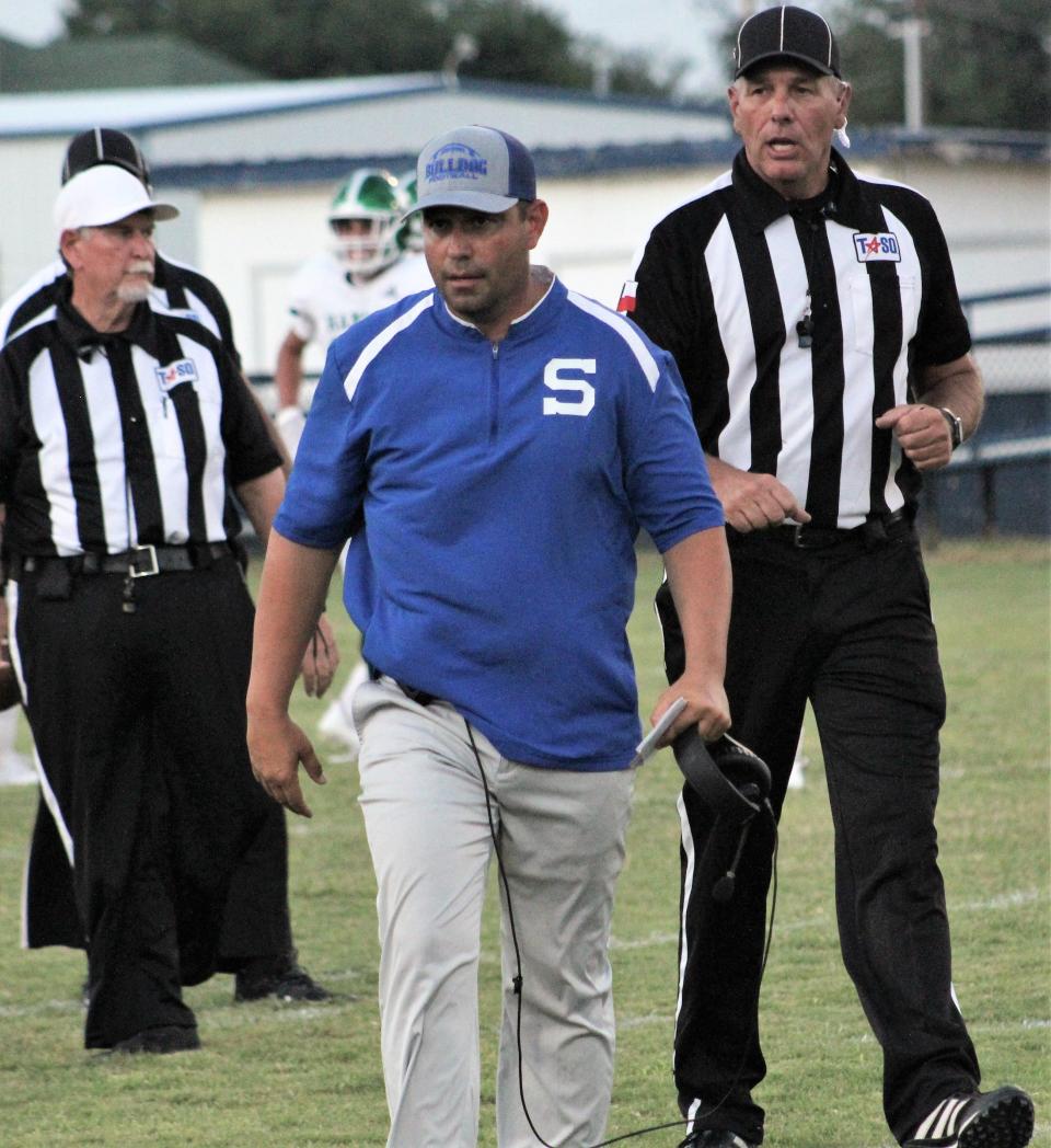 Stamford's Britt Hart talks to officials during the Bulldogs' game against Hamlin on Aug. 27, 2021.