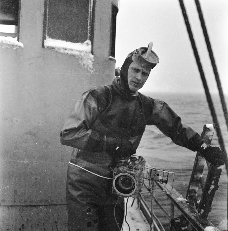 <div class="inline-image__caption"><p>Lofoten Islands, Norway, March 1959 – Baldwin holding an underwater camera in preparation for a dive in freezing waters to photograph cod fish. </p></div> <div class="inline-image__credit">All photographs are copyright Fred Baldwin from the book Dear Mr. Picasso: An Illustrated Love Affair with Freedom published by Schilt Publishing</div>