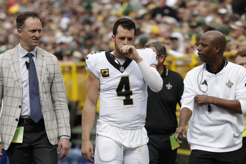 New Orleans Saints quarterback Derek Carr (4) walks to the locker room after being injured during the second half of an NFL football game against the Green Bay Packers Sunday, Sept. 24, 2023, in Green Bay, Wis. (AP Photo/Matt Ludtke)