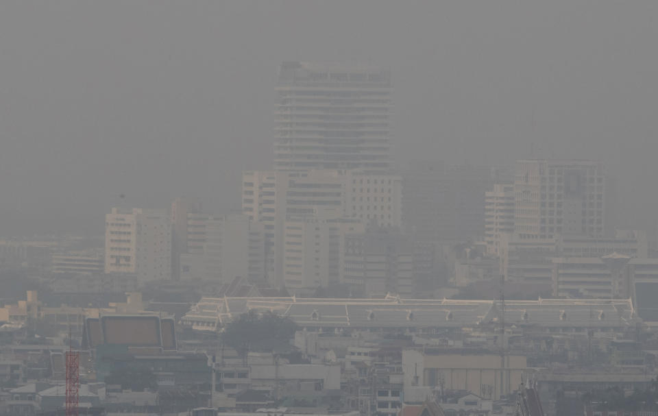 A thick layer of smog covers central Bangkok, Thailand, Monday, Jan. 20, 2020. Thick haze blanketed the Thai capital on Monday sending air pollution levels soaring to 89 micrograms per cubic meter of PM2.5 particles in some areas, according to the Pollution Control Department. (AP Photo/Sakchai Lalit)