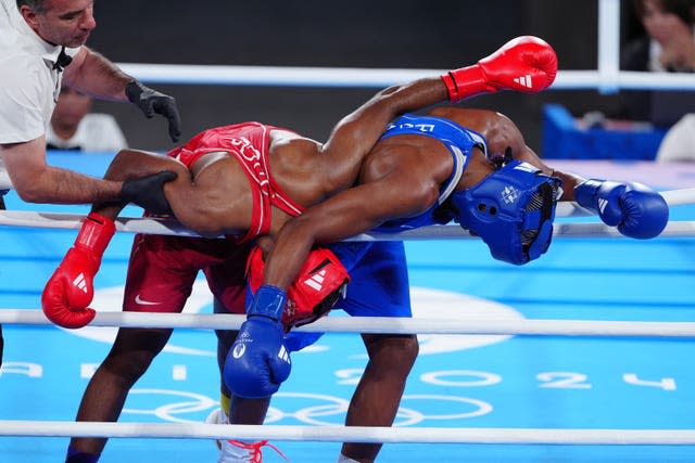 Cindy Ngamba, left, and Atheyna Bylon tangle on the ropes during their Olympic semi-final