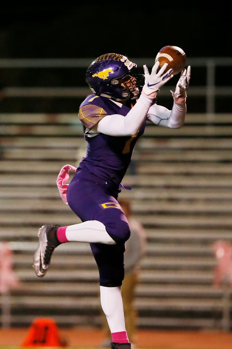 Burges' Alec Marenco completes a pass to score a touchdown against Bowie Friday, Oct. 25, at Burger High School in El Paso.