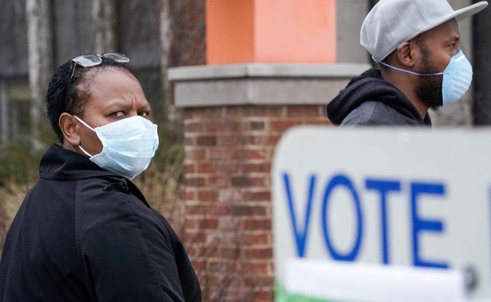 Voters masked against the coronavirus line up at Riverside High School in Milwaukee for Wisconsin's primary election on Tuesday. (Photo: Morry Gash/Associated Press)