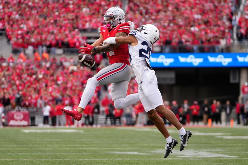 Oct 21, 2023; Columbus, Ohio, USA; Penn State Nittany Lions cornerback Daequan Hardy (25) breaks up a pass for Ohio State Buckeyes wide receiver Julian Fleming (4) during the first half of the NCAA football game at Ohio Stadium.