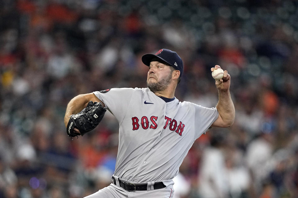 Boston Red Sox starting pitcher Rich Hill throws against the Houston Astros during the first inning of a baseball game Wednesday, Aug. 3, 2022, in Houston. (AP Photo/David J. Phillip)