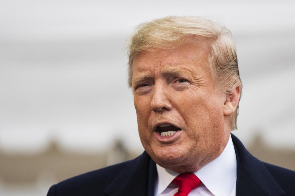 President Donald Trump speaks to the members of the media before leaving the White House, Monday, Jan. 13, 2020, in Washington, for a trip to watch the College Football Playoff national championship game between LSU and Clemson in New Orleans. (AP Photo/Manuel Balce Ceneta)