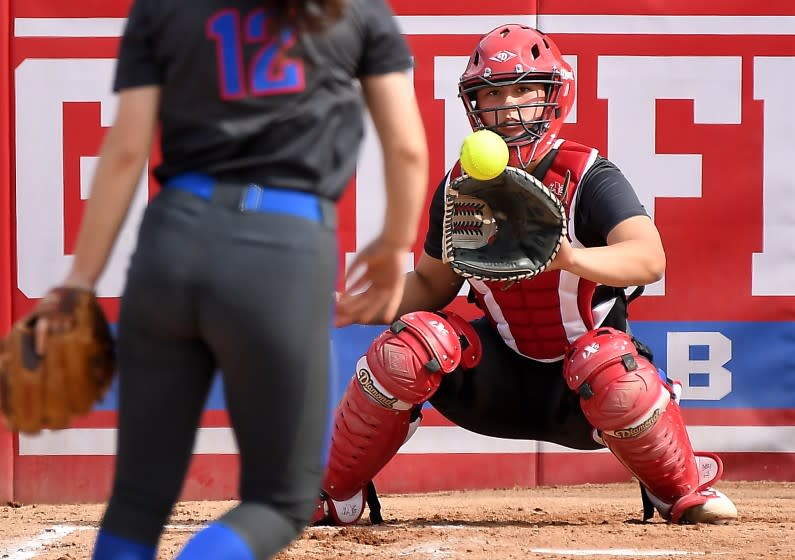 LOS ALAMITOS, CALIFORNIA APRIL 19, 2021-Los Alamitos High School softball catcher Sophia Nugent warms-up before a recent game. (Wally Skalij/Los Angeles Times)