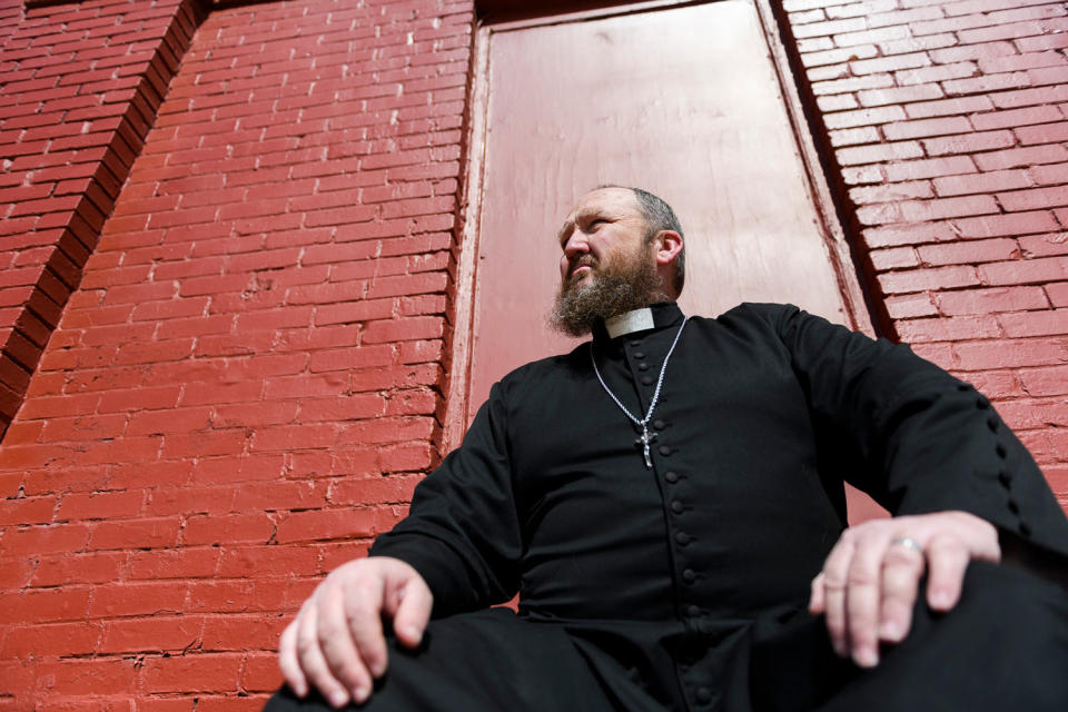 James Neal is known for his embrace of Enid’s LGBTQ community. He calls himself “the weird priest in the dress shouting into the storm.”  (Michael Noble Jr. for NBC News)