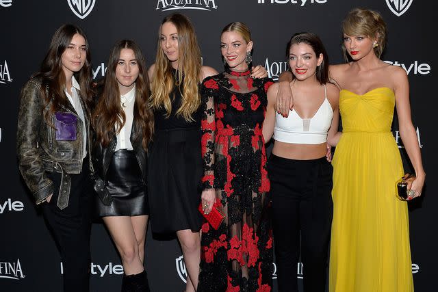 <p>Lester Cohen/WireImage</p> Taylor Swift with Haim, Jaime King and Lorde at InStyle Golden Globe Party