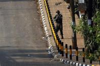 A Kenyan soldier walks outside the Westgate shopping centre in Nairobi September 23, 2013. REUTERS/Goran Tomasevic