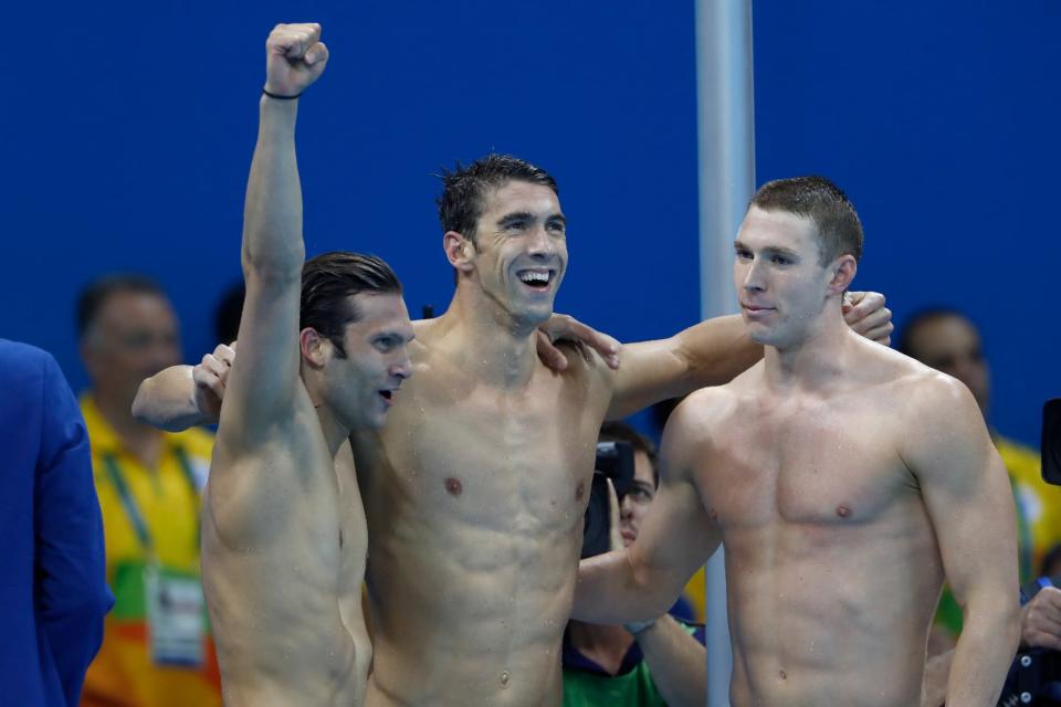 <p>Cody Miller, Michael Phelps and Ryan Murphy of the United States celebrate winning gold in the Men’s 4 x 100m Medley Relay Final on Day 8 of the Rio 2016 Olympic Games at the Olympic Aquatics Stadium on August 13, 2016 in Rio de Janeiro, Brazil. (Photo by Clive Rose/Getty Images) </p>