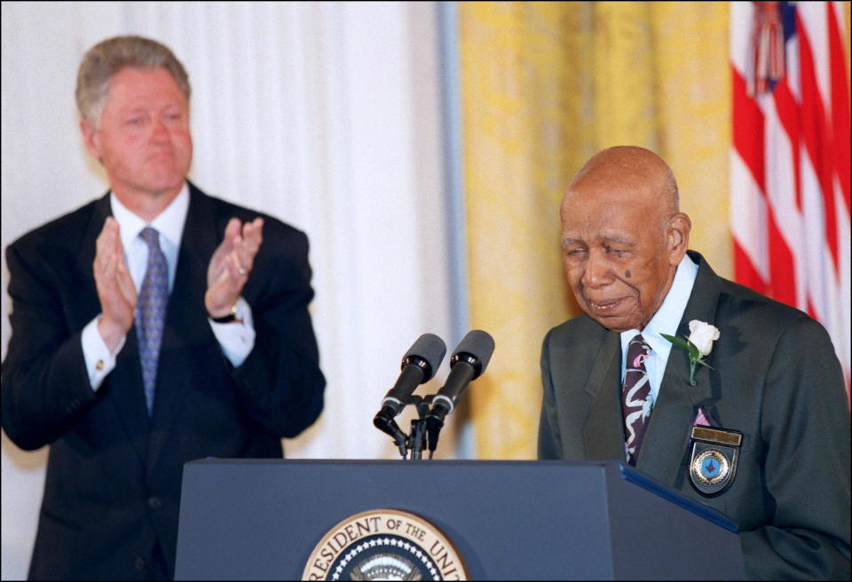 WASHINGTON, :  Ninety-four-year-old Herman Shaw (R) speaks as US President Bill Clinton looks on during ceremonies at the White House in Washington 16 May in which Clinton apologized to the survivors and families of the victims of the Tuskegee Syphilis Study. Shaw and nearly 400 other black men were part of a government study that followed the progress of syphilis and were told that they were being treated, but were actually given only a placebo. (Photo credit should read PAUL J. RICHARDS/AFP via Getty Images)