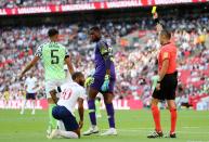 <p>Raheem Sterling receives a yellow card from match referee Marco Guida, after diving in the penalty area </p>