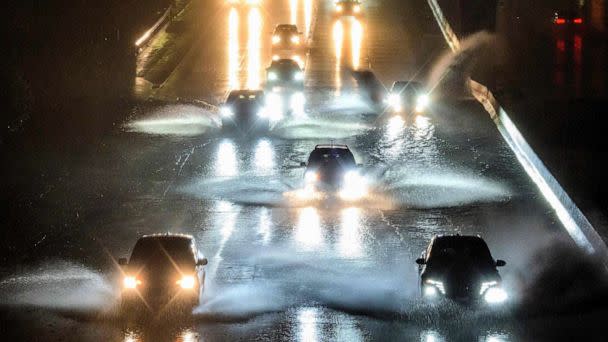 PHOTO: Drivers barrel into standing water on Interstate 101 in San Francisco, Jan. 4, 2023. (Josh Edelson/AFP via Getty Images)