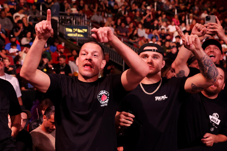 GLENDALE, ARIZONA - OCTOBER 29: MMA fighter Nate Diaz (L) reacts during the cruiserweight bout between Chris Avila and Mike Varshavski at Desert Diamond Arena on October 29, 2022 in Glendale, Arizona. (Photo by Christian Petersen/Getty Images)