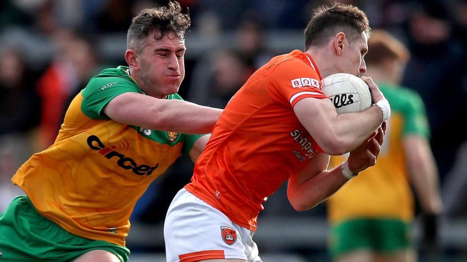 Patrick McBrearty battles with Armagh's Joe McElroy in the Division Two League contest at the Athletic Grounds in February