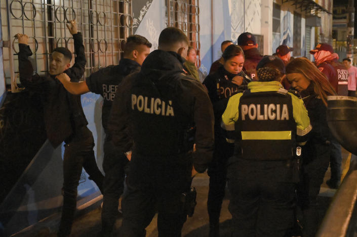 FILE - Police officer run a checkpoint set up in the nightclubs and bar zone of San Jose, Costa Rica, Jan 27, 2023. According to authorities, the Central American nation has reached its highest murder rate since the Organization of Judicial Investigation office has kept records. (AP Photo/Carlos Gonzalez, File)