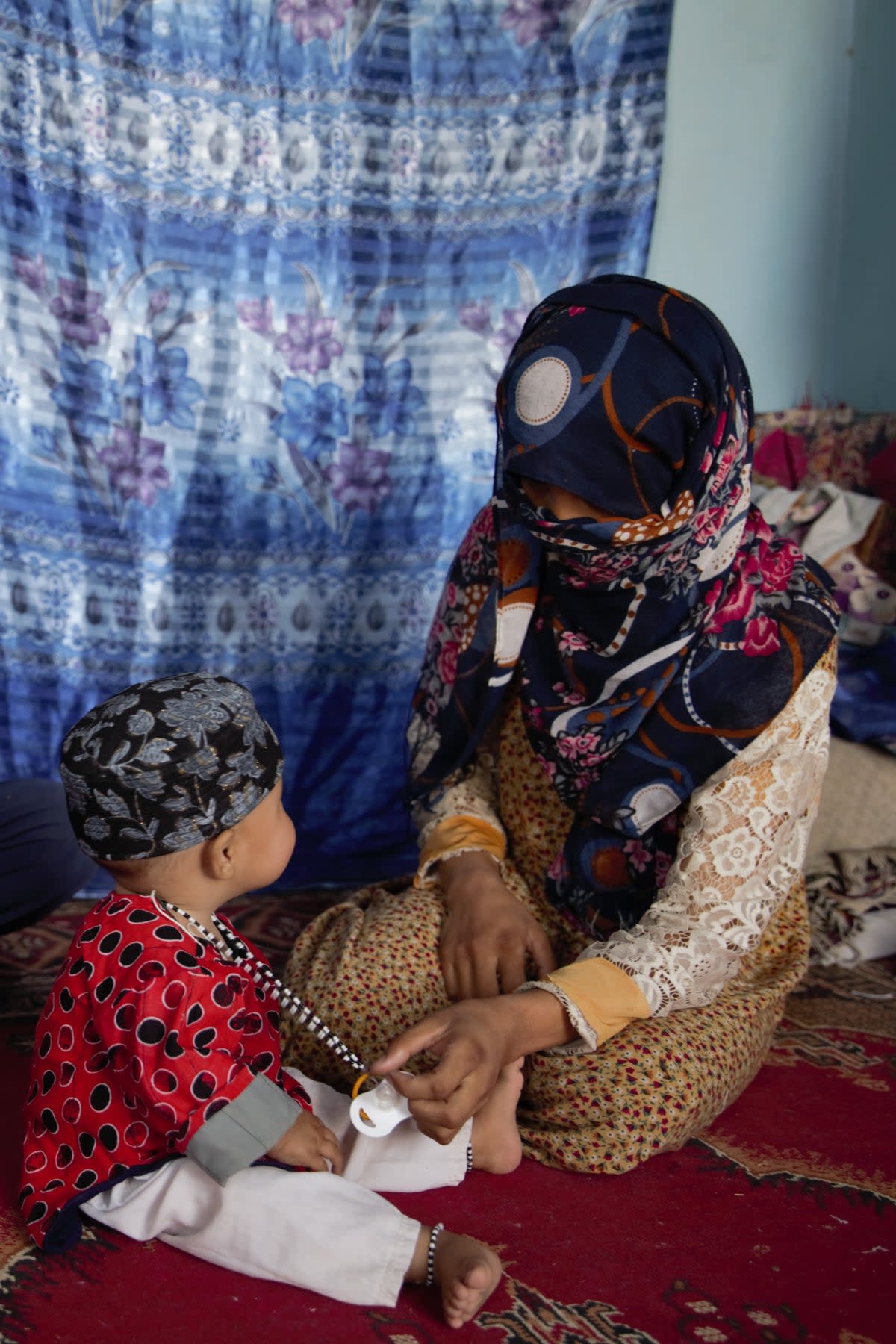 Zolaikha, 23, with Marium, aged 10 months (Save The Children)