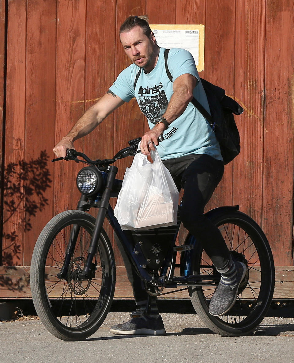 <p>Dax Shepard is seen riding his bike through L.A. after grabbing some food on Wednesday.</p>