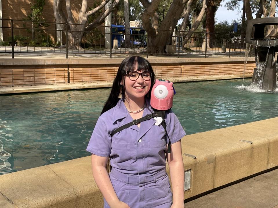 <div class="inline-image__caption"><p>SkoBot inventor Danielle Boyer wears one of her customizable language-teaching devices strapped to her shoulder. </p></div> <div class="inline-image__credit">The STEAM Connection</div>