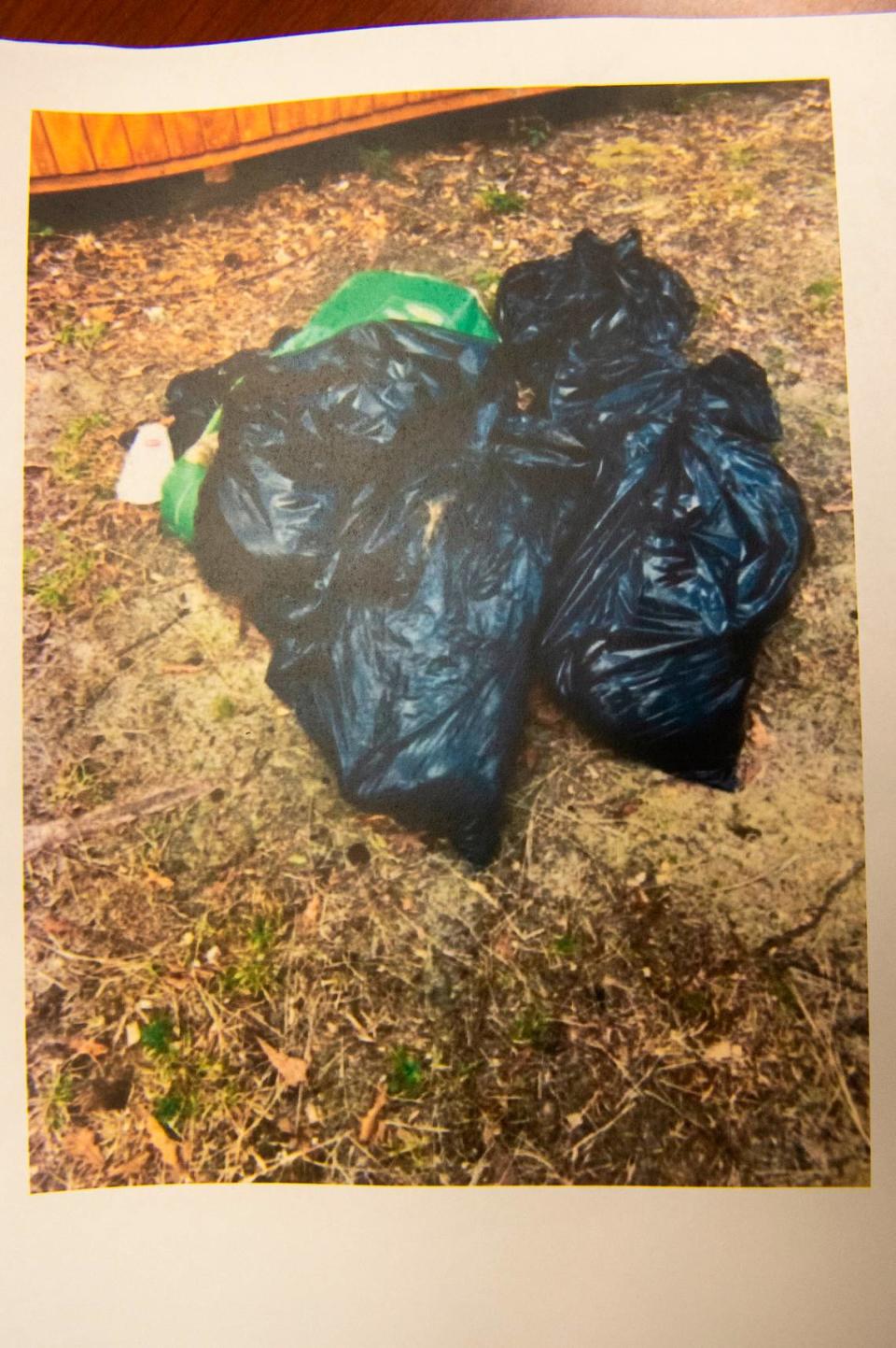 A photo taken by a Harrison County Sheriff’s Department Animal Control officer shows dead dogs wrapped in trash bags found on a property where Jessica Collins kept several dead dogs in Saucier. Collins pleaded no contest to 10 counts of simple animal cruelty to a domesticated dog at Harrison County Justice Court in Gulfport on Friday, Aug. 11, 2023.