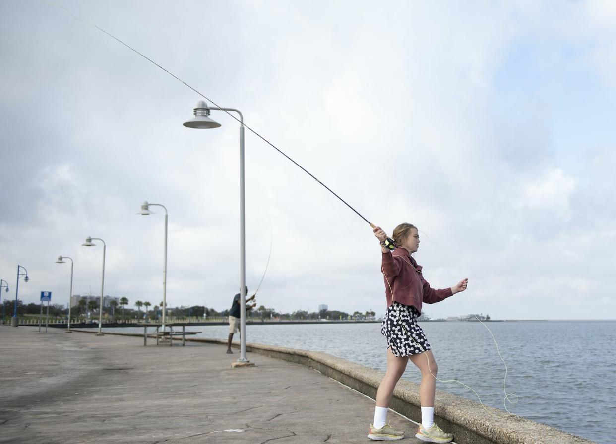 Mae Bennett, a student in the author's class, practices fly-casting on Lake Pontchartrain in New Orleans. Kyle Encar/Loyola University New Orleans