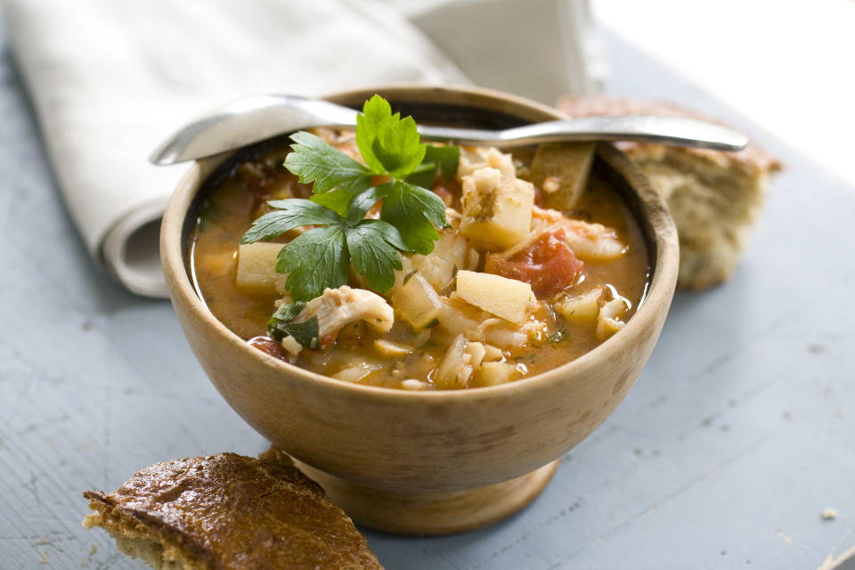 This Sept. 16, 2013 photo shows spicy shrimp and haddock stew in Condord, N.H. Seafood stew is every bit as rich and flavorful as a good chili or meat-based stew, but cooks up in no time. Unlike beef, which needs a long, low simmer to become tender, seafood prefers to be cooked quickly, otherwise it can toughen up. (AP Photo/Matthew Mead)