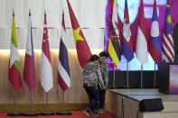 Workers arrange the flags of member countries during the Association of Southeast Asian Nations (ASEAN) Summit in Jakarta, Indonesia, Tuesday, Sept. 5, 2023. (AP Photo/Dita Alangkara)