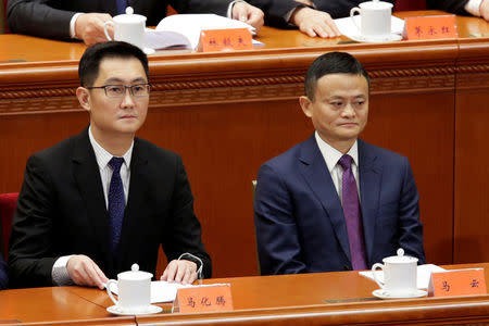 Tencent's Chief Executive Officer Pony Ma and Alibaba's Executive Chairman Jack Ma attend an event marking the 40th anniversary of China's reform and opening up at the Great Hall of the People in Beijing, China December 18, 2018. REUTERS/Jason Lee