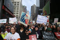 <p>Protesters cheer and hold up signs at the “I am a Muslim too” rally at Times Square in New York City on Feb. 19, 2017. (Gordon Donovan/Yahoo News) </p>