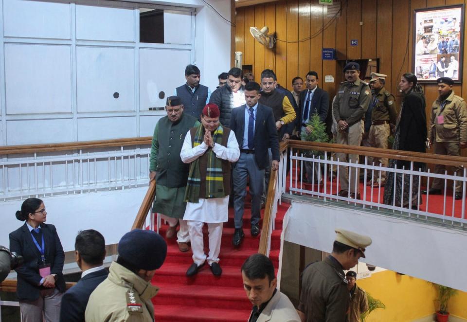 Uttarakhand Chief Minister Pushkar Singh Dhami, center, gestures as he arrives to attend a special session of the state assembly that passed a uniform marriage law for all religions in Dehradun (AP)