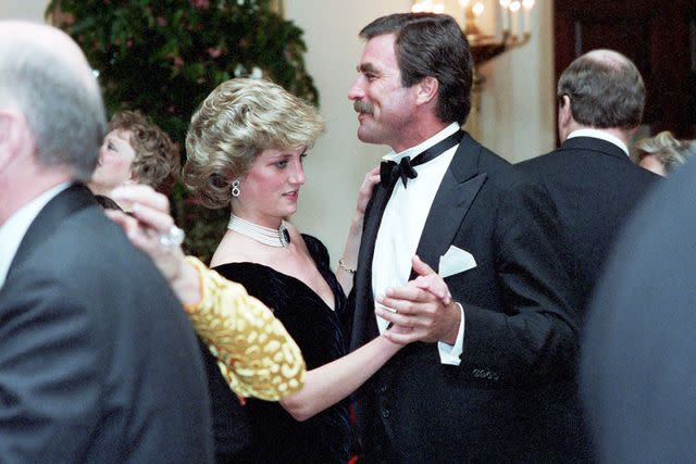 <p>Shutterstock</p> Princess Diana (Left) with Tom Selleck in 1985