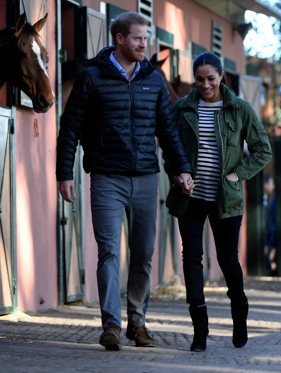 <p>At the Moroccan Royal Federation of Equestrian Sports in Rabat, Meghan donned her trusty khaki <a rel="nofollow noopener" href="https://www.jcrew.com/uk/p/E0945" target="_blank" data-ylk="slk:J. Crew ‘Field Mechanic’ jacket;elm:context_link;itc:0;sec:content-canvas" class="link ">J. Crew ‘Field Mechanic’ jacket</a> with a striped sweater by French label Equipment, <a rel="nofollow noopener" href="https://www.shopbop.com/maternity-skinny-jeans-rag-bone/vp/v=1/1583789317.htm?fm=search-viewall-shopbysize&os=false" target="_blank" data-ylk="slk:Rag & Bone skinny maternity jeans;elm:context_link;itc:0;sec:content-canvas" class="link ">Rag & Bone skinny maternity jeans</a> and <a rel="nofollow noopener" href="https://www.saksfifthavenue.com/stuart-weitzman-brooks-suede-booties/product/0400098880069?ranMID=37410&ranEAID=0RpXOIXA500&ranSiteID=0RpXOIXA500-iO3_3OiVQ9vCW041Q7wYNw&site_refer=AFF001&mid=37410&siteID=0RpXOIXA500-iO3_3OiVQ9vCW041Q7wYNw&ranMID=37410&ranEAID=QFGLnEolOWg&ranSiteID=QFGLnEolOWg-YClXUJnqTO6CYl13MTopfA&site_refer=AFF001&mid=37410&siteID=QFGLnEolOWg-YClXUJnqTO6CYl13MTopfA" target="_blank" data-ylk="slk:Stuart Weitzman heeled boots;elm:context_link;itc:0;sec:content-canvas" class="link ">Stuart Weitzman heeled boots</a>. [Photo: Getty] </p>