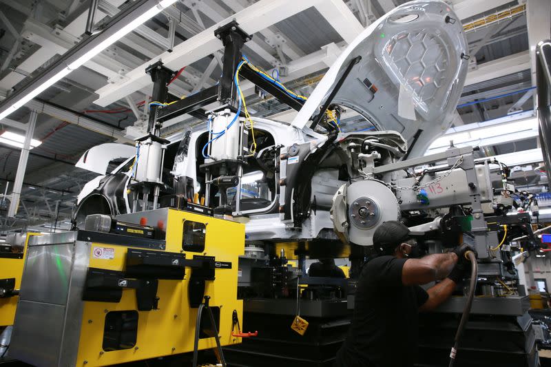 Workers assemble electric vehicles at the Lucid Motors plant in Casa Grande