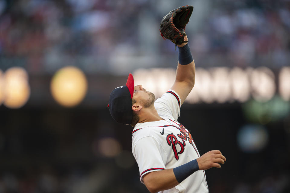 Atlanta Braves third baseman Austin Riley fields fly ball hit by San Francisco Giants Wilmer Flores in the fourth inning of a baseball game, Monday, June 20, 2022, in Atlanta. (AP Photo/Hakim Wright Sr.)