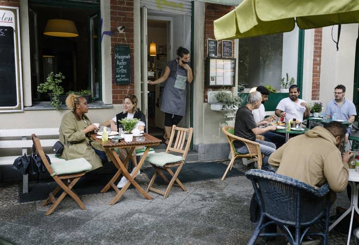 People sitting at an outdoor cafe.